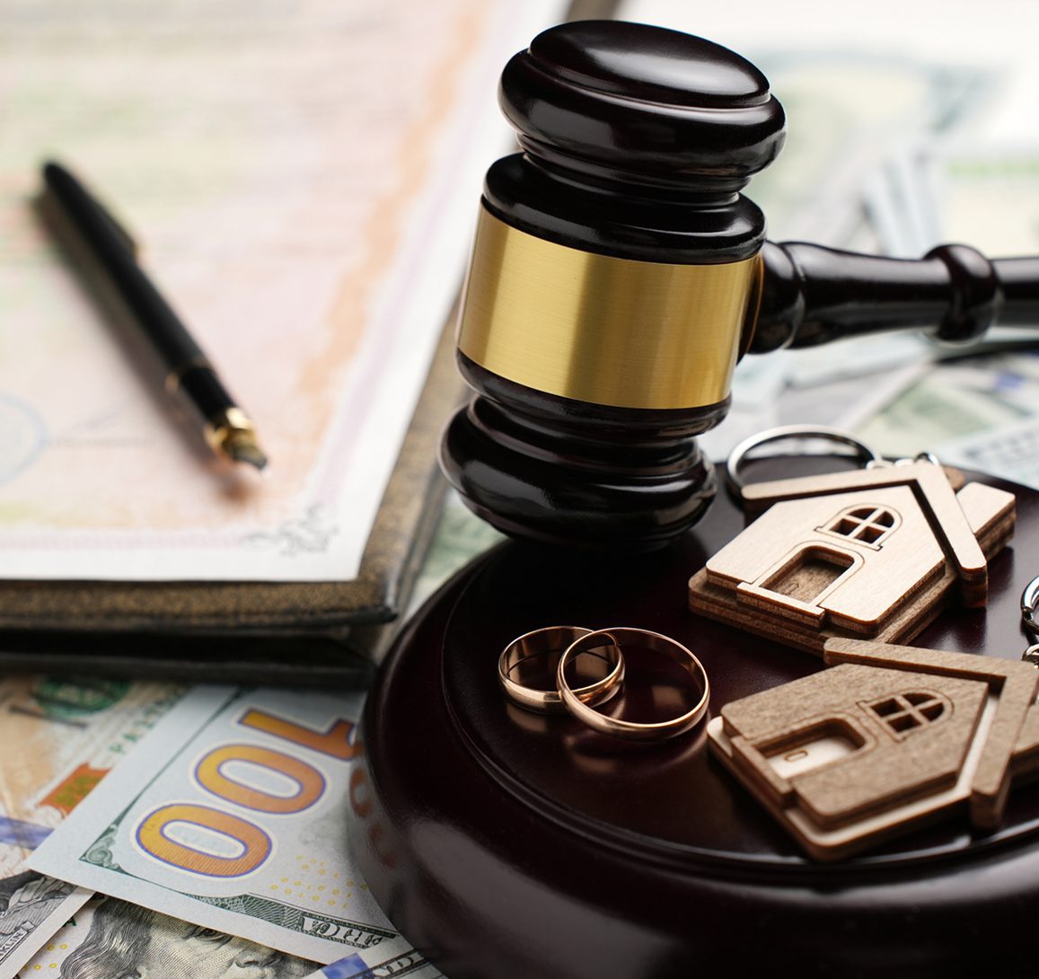 Divorce settlement concept with gavel and assets