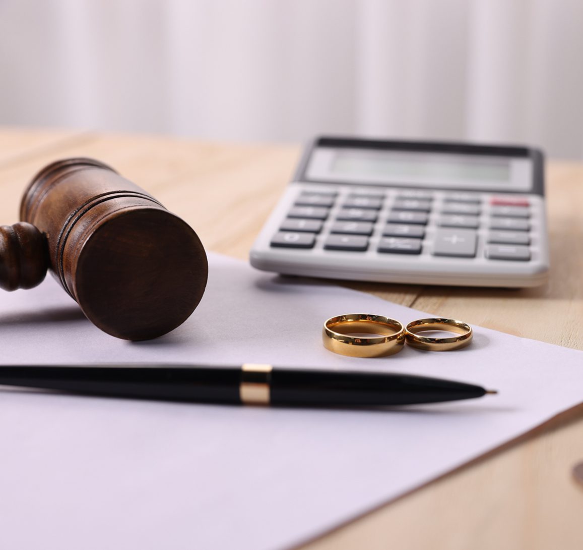 Legal paperwork with rings and pen