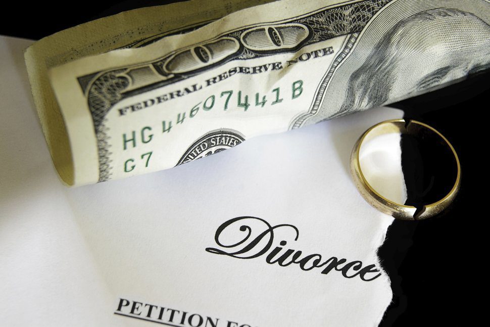 Divorce paperwork, cash, and gold ring