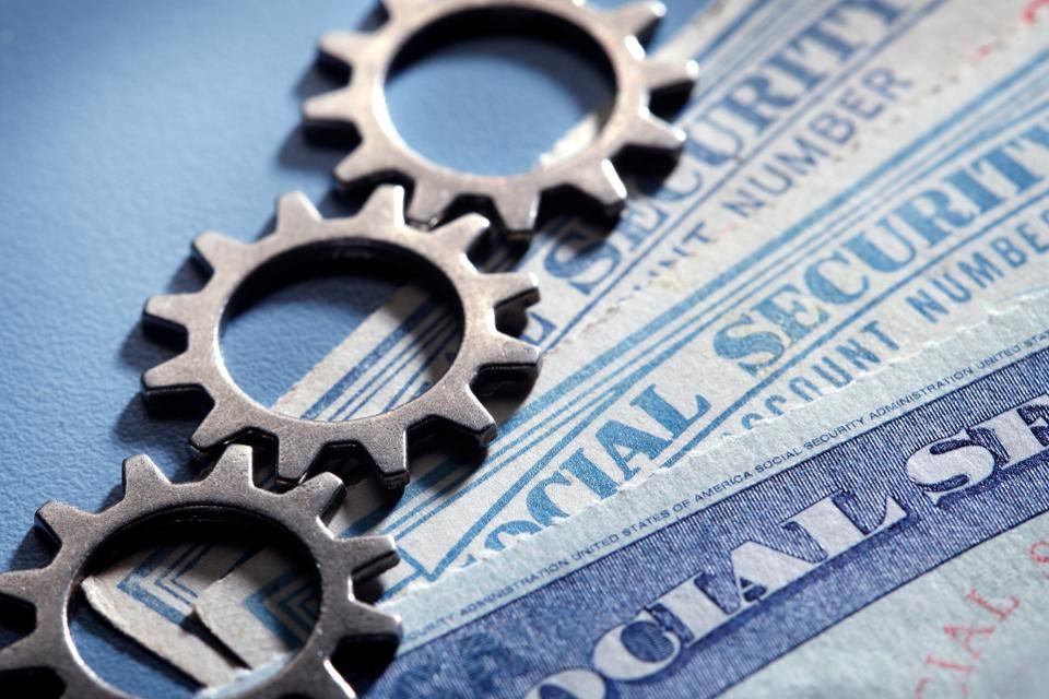 Metal gears atop official papers